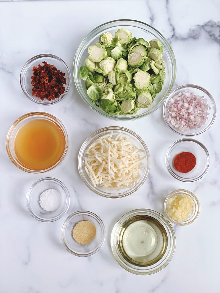 All of the ingredients for the Daiya Cheesy Garlic Brussels Sprouts separated into bowls